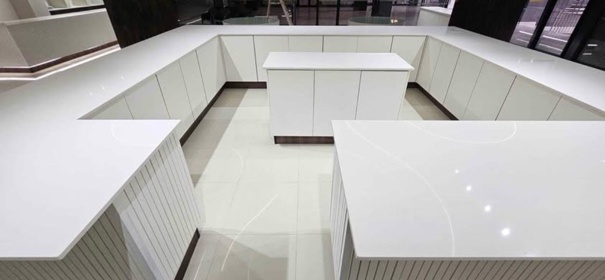 Custom white stone top counters with panel detailing