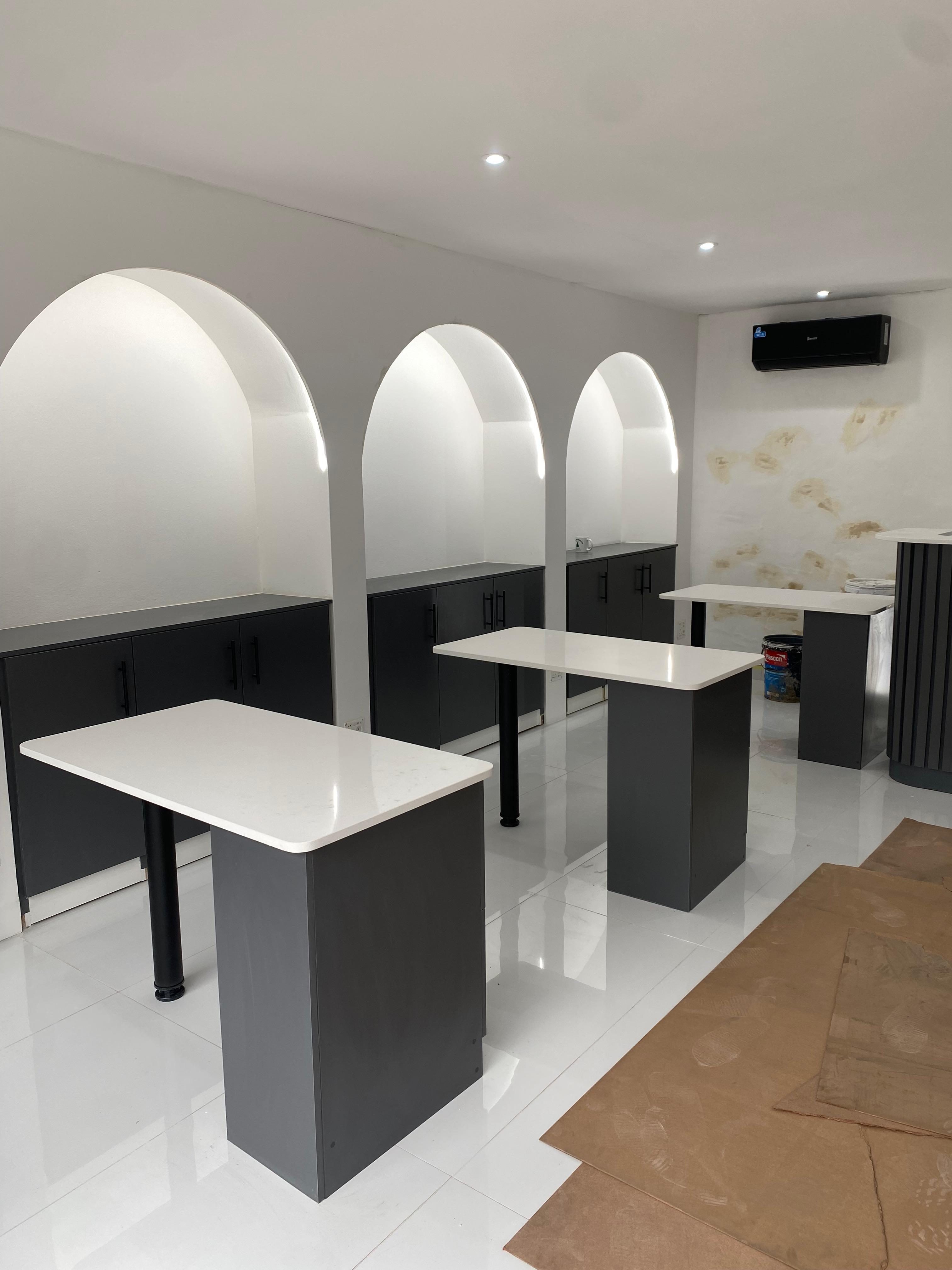 Interior fit-out with arched alcoves and cabinetry