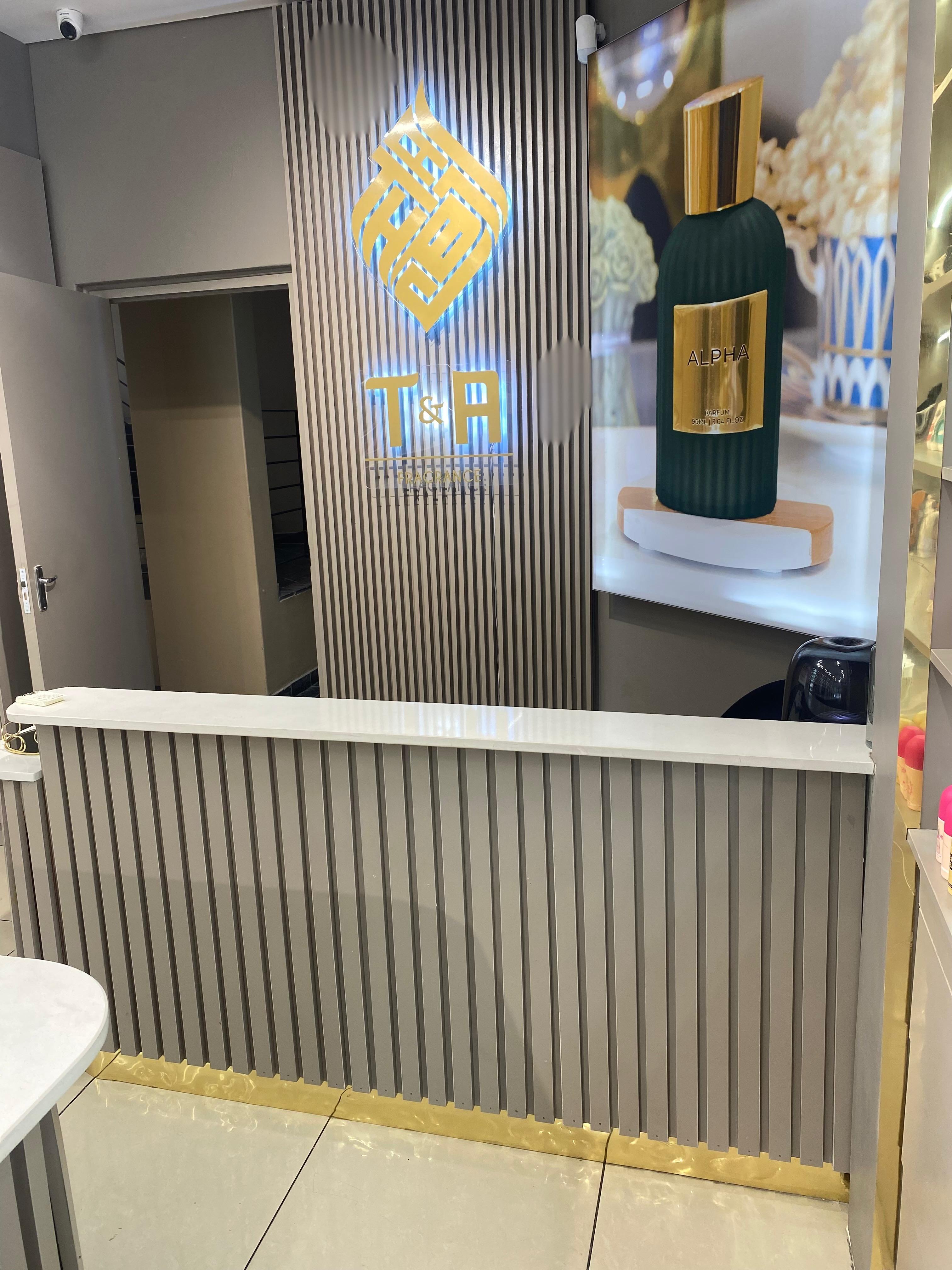 Feature wall with slatted paneling and branding